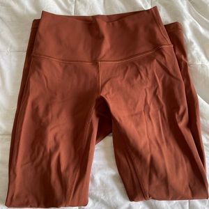 more of a fall color, lips toned down burnt orange | leggings from lululemon